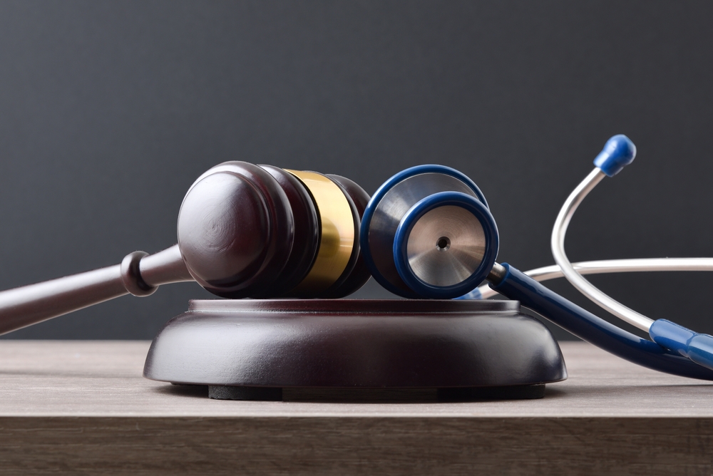 Fair,Social,Justice,Concept,With,Gavel,And,Stethoscope,On,Wooden